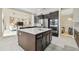 Gourmet kitchen with stainless appliances, center island and open floor plan at 2709 Coco Palm Cir, Wesley Chapel, FL 33543