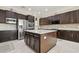Spacious kitchen featuring stainless steel appliances and a large center island at 2709 Coco Palm Cir, Wesley Chapel, FL 33543