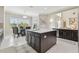 Bright kitchen and breakfast nook with tiled flooring and a center island at 2709 Coco Palm Cir, Wesley Chapel, FL 33543