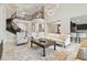 Open-concept living room with staircase, neutral decor, and seamless transition to the kitchen at 2709 Coco Palm Cir, Wesley Chapel, FL 33543