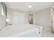 Spacious main bedroom with white bed, carpet and walk-in closet at 2709 Coco Palm Cir, Wesley Chapel, FL 33543