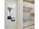 Mud room with built in bench and storage with direct access to a bedroom at 2709 Coco Palm Cir, Wesley Chapel, FL 33543