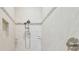 Shower with neutral tile, niche, and dual shower heads offers a spa-like experience at 2709 Coco Palm Cir, Wesley Chapel, FL 33543