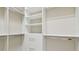 Organized walk-in closet with ample shelving, drawers, and storage for clothing at 2709 Coco Palm Cir, Wesley Chapel, FL 33543
