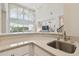 Wet bar featuring granite countertop and stainless steel sink at 2709 Coco Palm Cir, Wesley Chapel, FL 33543