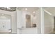 Stylish wet bar area with light counters and cabinetry, perfect for entertaining guests at 2709 Coco Palm Cir, Wesley Chapel, FL 33543