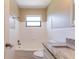 Bathroom boasts shower-over-tub, granite countertop, and white tile at 6730 32Nd N Ave, St Petersburg, FL 33710