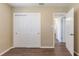 Bedroom features wood flooring and double closet with sliding doors at 6730 32Nd N Ave, St Petersburg, FL 33710