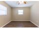 Comfortable bedroom with natural light from two windows, and wood-look floors for a modern touch at 6730 32Nd N Ave, St Petersburg, FL 33710