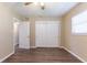 Bedroom features wood flooring, closet, ceiling fan, and window at 6730 32Nd N Ave, St Petersburg, FL 33710