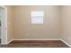 Empty bedroom featuring wood floors, neutral paint, and a bright window at 6730 32Nd N Ave, St Petersburg, FL 33710