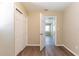 Bedroom features wood floors, neutral walls, and closet with an open doorway at 6730 32Nd N Ave, St Petersburg, FL 33710