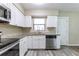 Well-lit kitchen features stainless steel dishwasher, modern countertops and sink under a window at 6730 32Nd N Ave, St Petersburg, FL 33710