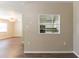 Open-concept living room with wood floors that is bright and airy at 6730 32Nd N Ave, St Petersburg, FL 33710