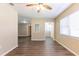 Spacious open living area with wood-look flooring, ceiling fan and plentiful natural light at 6730 32Nd N Ave, St Petersburg, FL 33710
