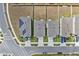 Aerial view of suburban homes featuring solar panels, driveways, and fenced yards at 7617 Wallflower Trl, Wesley Chapel, FL 33545