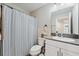 This bathroom features a large vanity with modern fixtures and a shower tub combination at 7617 Wallflower Trl, Wesley Chapel, FL 33545