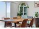 Dining room featuring wooden table and chairs with natural light from sliding glass doors at 7617 Wallflower Trl, Wesley Chapel, FL 33545