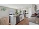 Spacious kitchen with stainless steel appliances, island, and easy access to the dining area at 7617 Wallflower Trl, Wesley Chapel, FL 33545