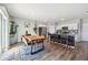 Bright, airy kitchen with a stainless steel refrigerator and a wooden dining table adjacent at 7617 Wallflower Trl, Wesley Chapel, FL 33545