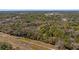 Aerial view of sprawling wooded acreage, showcasing the natural beauty of the landscape at 18218 Railroad Rd, Spring Hill, FL 34610
