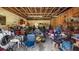 Cluttered garage space with tools, equipment, and storage, providing ample room for projects at 18218 Railroad Rd, Spring Hill, FL 34610