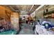 Spacious garage with exposed ceiling beams and ample storage space at 18218 Railroad Rd, Spring Hill, FL 34610