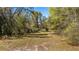 Land in the front with tree coverage and privacy at 18218 Railroad Rd, Spring Hill, FL 34610