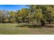Outbuilding on property with shaded land and partial tree coverage at 18218 Railroad Rd, Spring Hill, FL 34610