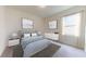 Comfortable bedroom featuring neutral tones, carpeted floors, and plenty of natural light from a bright window at 36183 Canelli Way, Dade City, FL 33523