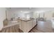 Open-concept kitchen with island, stainless steel appliances, granite countertops, and dining area at 36183 Canelli Way, Dade City, FL 33523