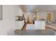 Spacious kitchen featuring white cabinets, stainless steel appliances, and an eat-in breakfast bar at 36183 Canelli Way, Dade City, FL 33523