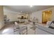 Inviting living room showcasing an open layout, neutral decor, and seamless flow to the kitchen at 36183 Canelli Way, Dade City, FL 33523