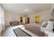 Serene primary bedroom featuring a plush bed, neutral décor, and an ensuite bathroom and walk-in closet at 36183 Canelli Way, Dade City, FL 33523