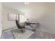 Functional home office featuring a modern desk, ergonomic chair, and neutral decor with carpeted floors at 36183 Canelli Way, Dade City, FL 33523