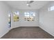 Spacious bedroom featuring bright windows with a view of the backyard pool and lake at 6741 64Th E Ter, Bradenton, FL 34203