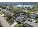 Aerial view of a single-Gathering home showcasing the pool and backyard with mature trees at 4907 21St W Ave, Bradenton, FL 34209