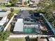 Aerial view of the home's backyard featuring a screened-in pool and fully fenced yard at 4907 21St W Ave, Bradenton, FL 34209