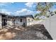 Backyard with access to enclosed patio and fenced area at 4907 21St W Ave, Bradenton, FL 34209