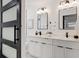 Modern bathroom with double vanity, sleek fixtures, and ample cabinet space at 4907 21St W Ave, Bradenton, FL 34209