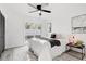 Serene bedroom with natural light, neutral tones, and a sliding glass door at 4907 21St W Ave, Bradenton, FL 34209