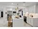 Bright kitchen featuring a large quartz island, stainless steel appliances, and modern pendant lighting at 4907 21St W Ave, Bradenton, FL 34209