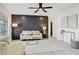 Living room with a large window, modern furnishings, wood plank flooring, and stylish decor at 4907 21St W Ave, Bradenton, FL 34209