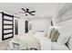 Bright main bedroom showcases a ceiling fan, neutral palette, and serene ambiance at 4907 21St W Ave, Bradenton, FL 34209