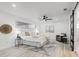 Comfortable bedroom with ceiling fan, soft lighting, and ensuite bathroom access at 4907 21St W Ave, Bradenton, FL 34209