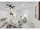 Well-lit main bedroom boasts a ceiling fan, soft textures, and stylish decor at 4907 21St W Ave, Bradenton, FL 34209