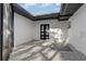Enclosed patio with stone flooring and black framed door at 4907 21St W Ave, Bradenton, FL 34209