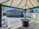 Back patio featuring a fire pit, view of the backyard, and sunshade at 3711 Huntington Ne St, St Petersburg, FL 33703