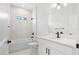 Stylish bathroom featuring marble-look tile, a modern vanity, and sleek fixtures at 4124 Mermell Cir, North Port, FL 34291