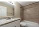 Updated bathroom features modern vanity, granite countertop, and tiled shower at 4129 Highland Loop, New Port Richey, FL 34652